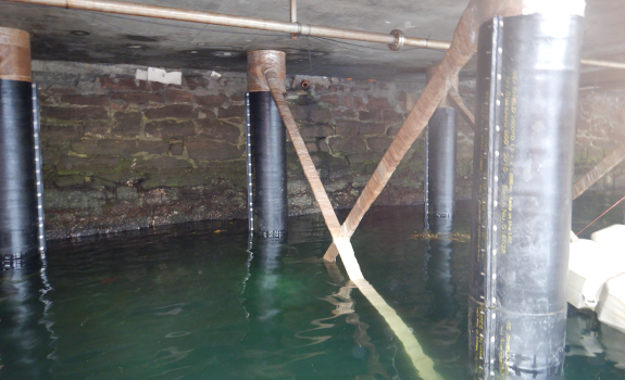 Completed SeaShield System applied to Ullapool harbour Jetty Piles