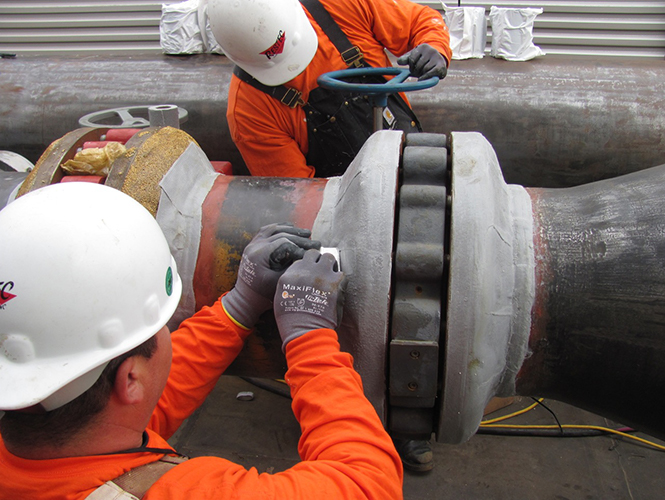 Steelcoat ColourTape being applied to a pipe flange