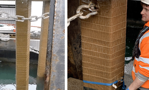A section of a jetty pile wrapped in a brown tape (SeaShield Marine Piling Tape)